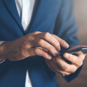 man hand holding smart phone